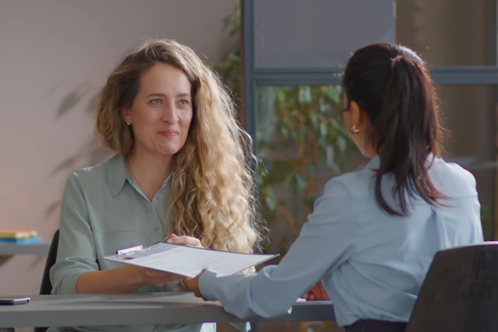 Video thumbnail, two women in a meeting